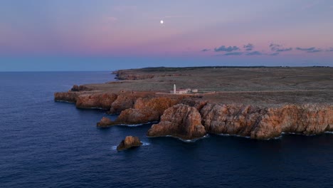 Beautiful-aerial-pull-back-reveal-of-steep-cliffs-of-Menorca,-Spain