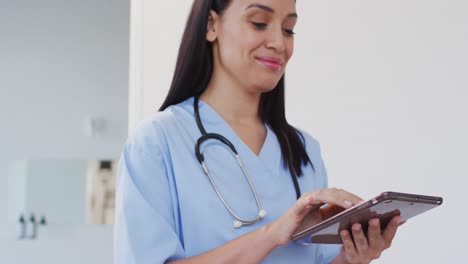 animation of happy biracial female doctor looking at camera