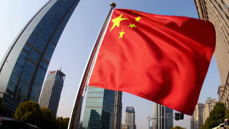 chinese flag waving in shanghai city