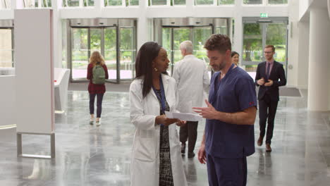 Staff-In-Busy-Lobby-Area-Of-Modern-Hospital-Shot-On-R3D