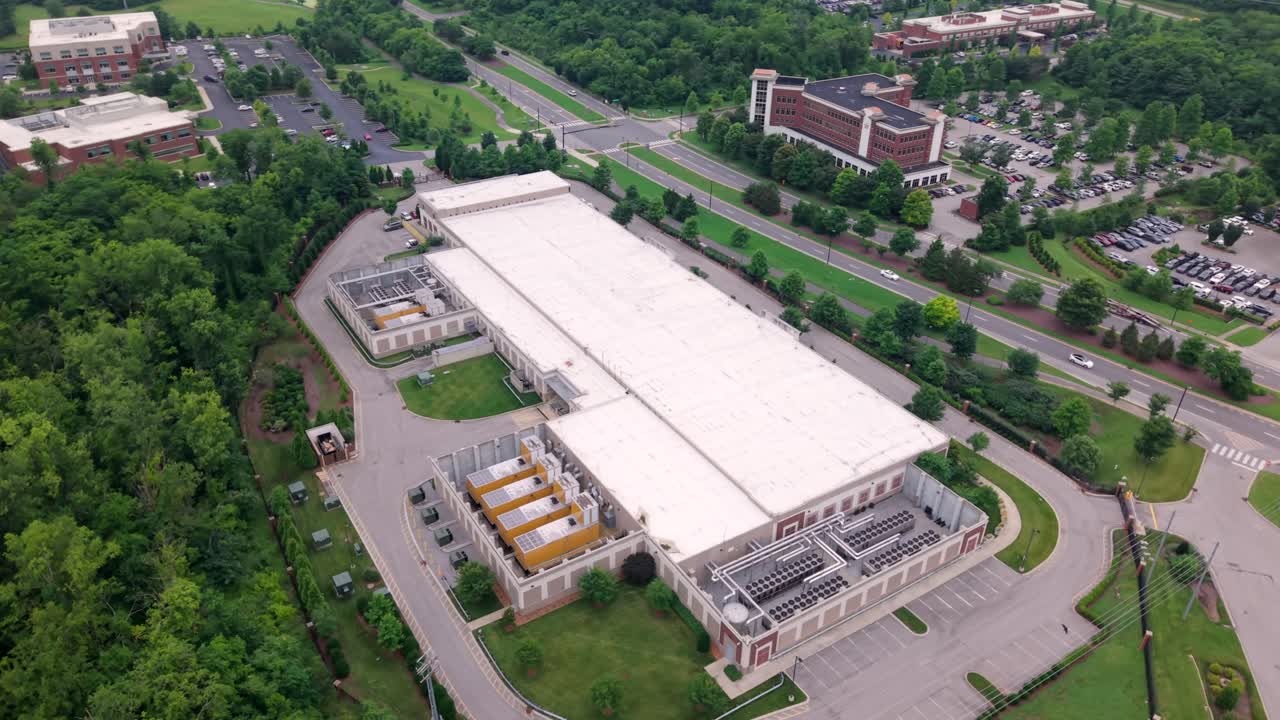 Data Center facility of outside infrastructure showing storage equipment in an aerial orbit view
