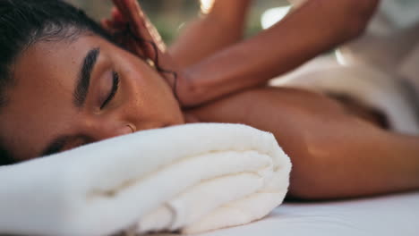 woman receiving a relaxing massage at a spa
