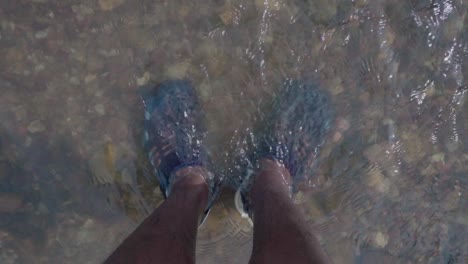 foot--in-natural-clear-water-river