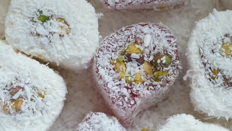 close-up of turkish delight covered in coconut and pistachios