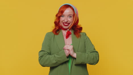 redheaded woman smiling friendly at camera and waving hands gesturing hello or goodbye, welcoming