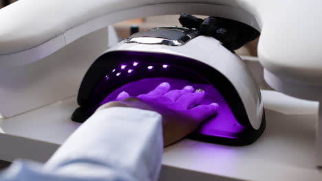 Woman Getting UV Gel Nails