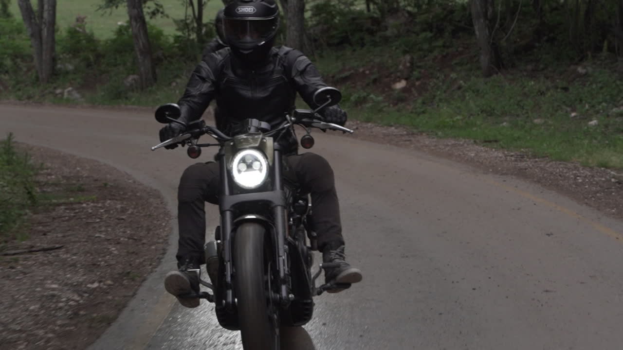 Two Motorcyclists on a Winding Road