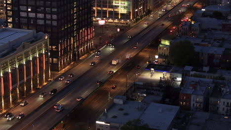 aerial view of rush hour traffic on brooklyn's belt parkway. shot at night in bay ridge with the verrazzano bridge in the background.