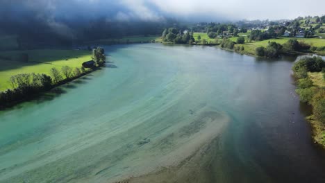 beautiful bend of glacier river in stryn, norway