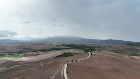 Road-With-Cypress-Trees-Along-The-Val-d'Orcia-Valley-In-Tuscany,-Italy