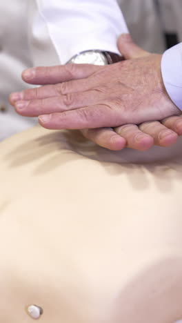 cpr training medical procedure workshop. model dummy for cpr training in medical class. vertical video