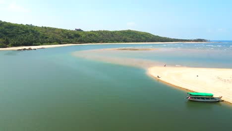 Devbag-Beach-drone-moving-closer-to-river-in-Malvan