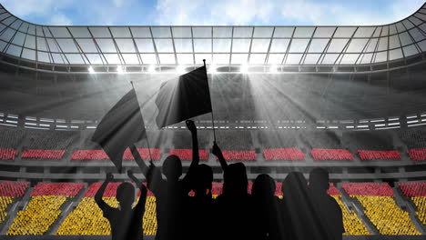 animation of silhouettes of sports fans cheering with german flag over sports stadium