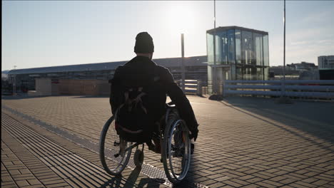 person in wheelchair outdoors