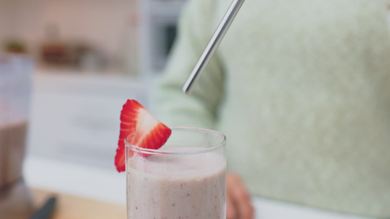 Health, smoothie and milkshake of woman hands stir