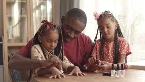 sisters painting fathers nails