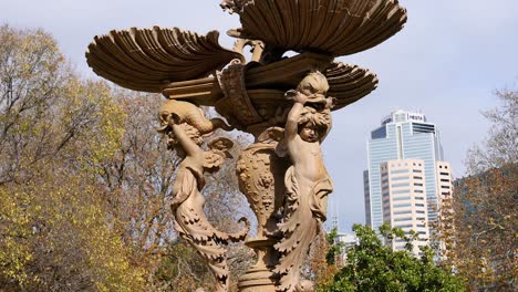 ornate statue with cityscape background