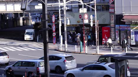 pedestrians and vehicles crossing an urban intersection