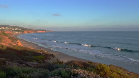 Crystal-Cove-State-Park-in-Corona-Del-Mar-California-panning-right-view-of-the-rocks,-cliffs,-and-small-waves-of-the-pacific-ocean