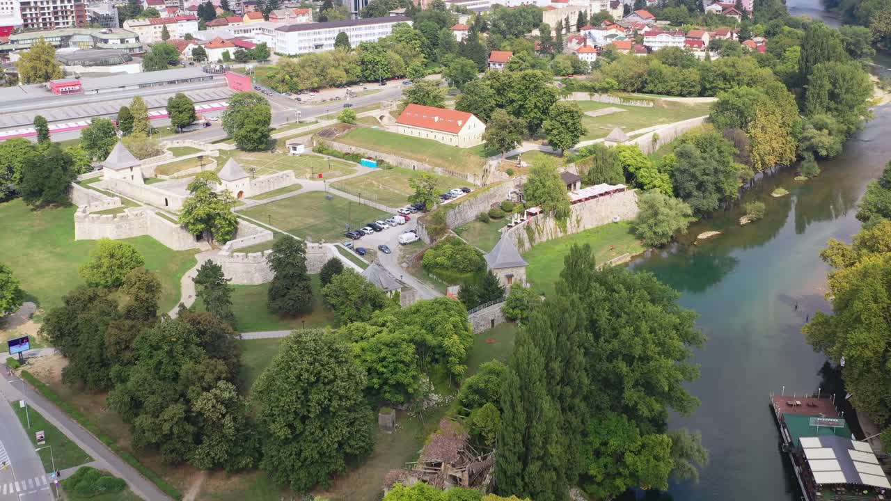 Aerial Over Castle Ruins Next To River In Bosnia and Herzegovina. Slow Dolly Back