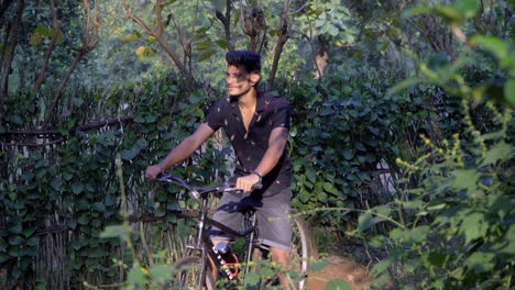 cyclist-riding-cycle-bike-in-the-deep-jungle-looking-choosing-for-path-in-sun-rays