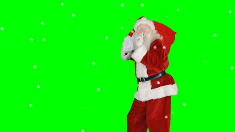 Animation-Des-Weihnachtsmanns-Mit-Finger-Auf-Den-Lippen,-Der-Einen-Sack-über-Grünem-Hintergrund-Trägt