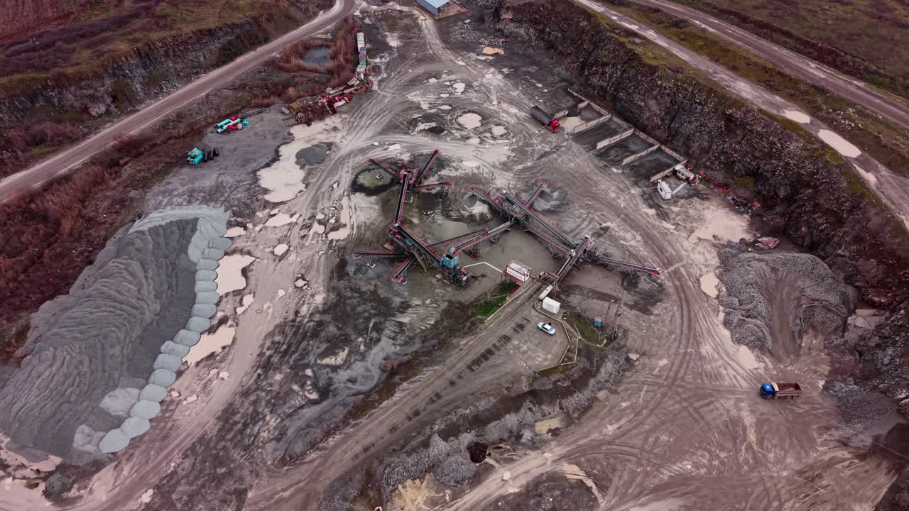Large scale quarry operation with heavy machinery for granite extraction