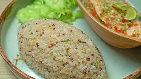 quinoa fried rice with steamed salmon in lime chilli dressing - healthy food style