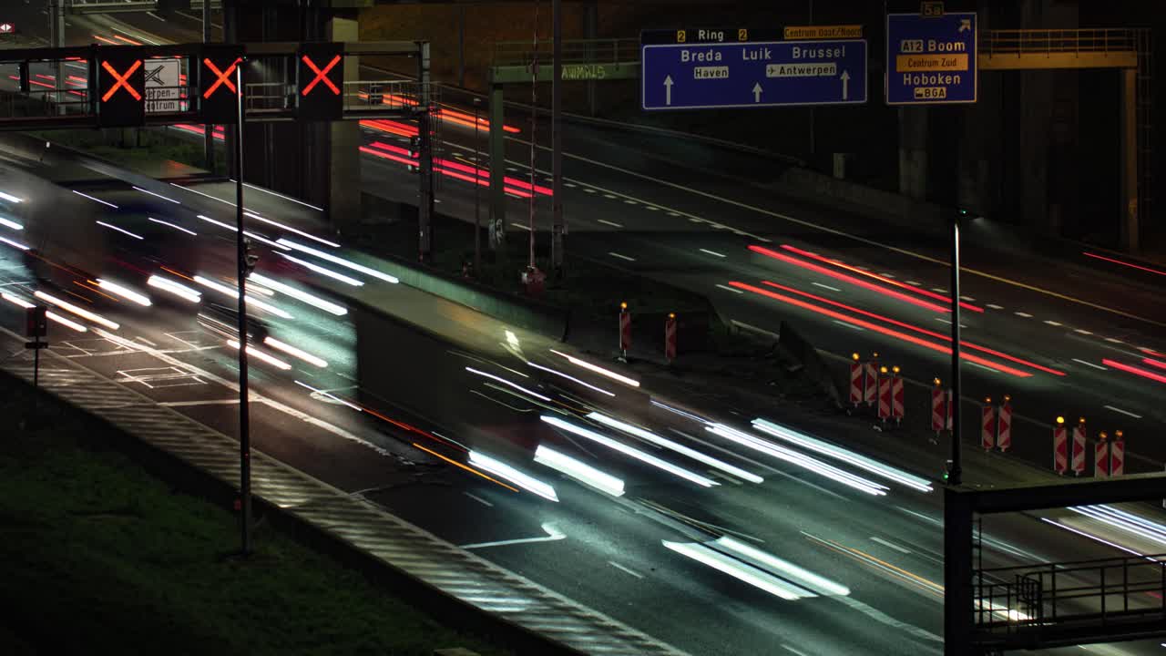 Dense traffic captured in a dynamic long-exposure timelapse on the Antwerp city's R1 ring road in Belgium