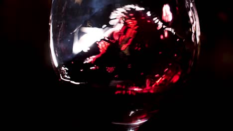 red wine swirling in glass