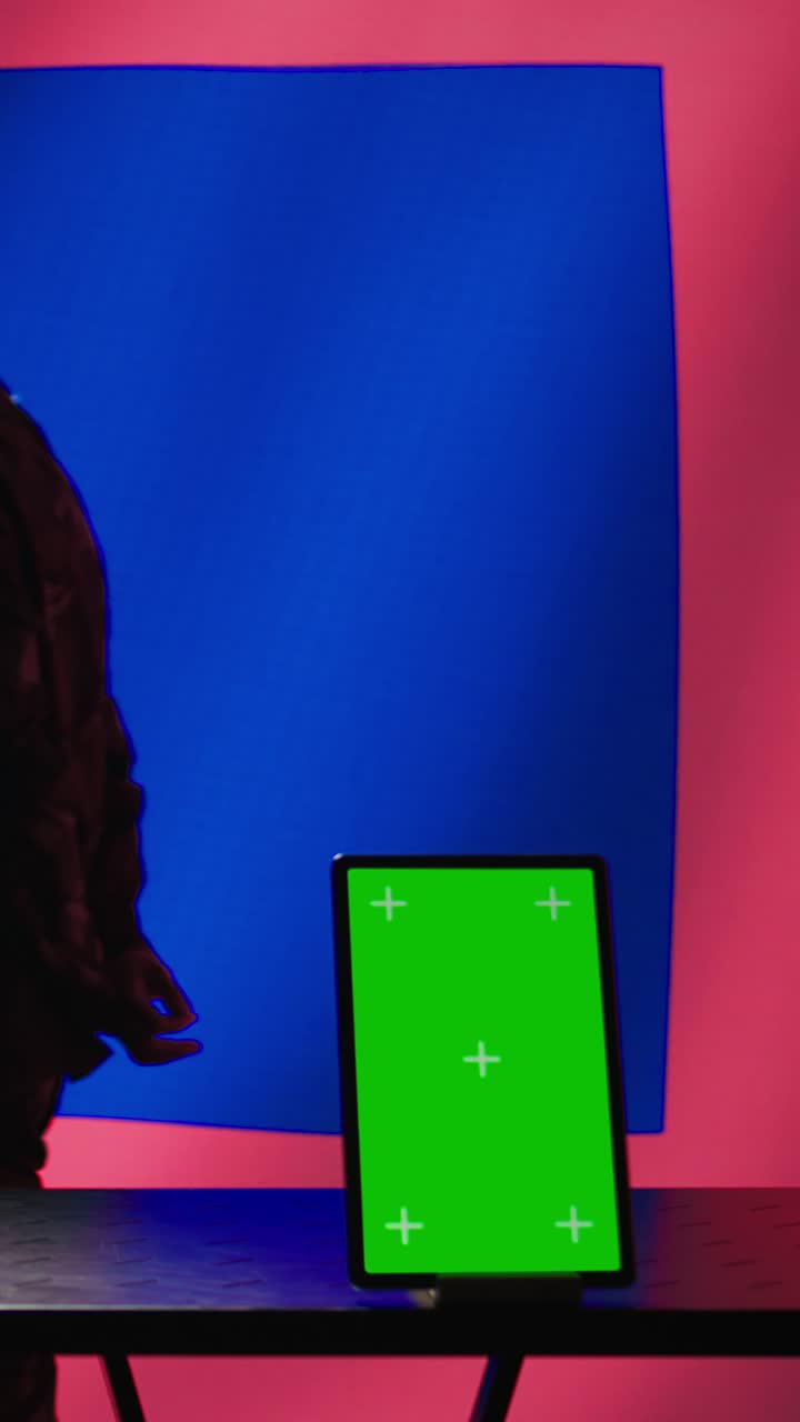 Vertical video Taiwan military unit patrolling in command room in front of chroma key device