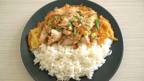 stir-fried pork with garlic and egg topped on rice - asian food style