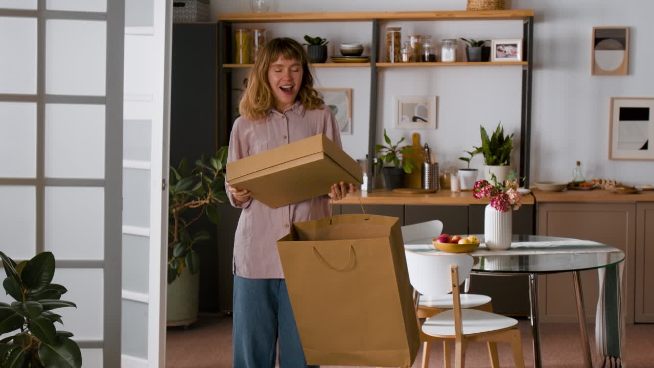 Woman unpacking a shopping bag in the kitchen