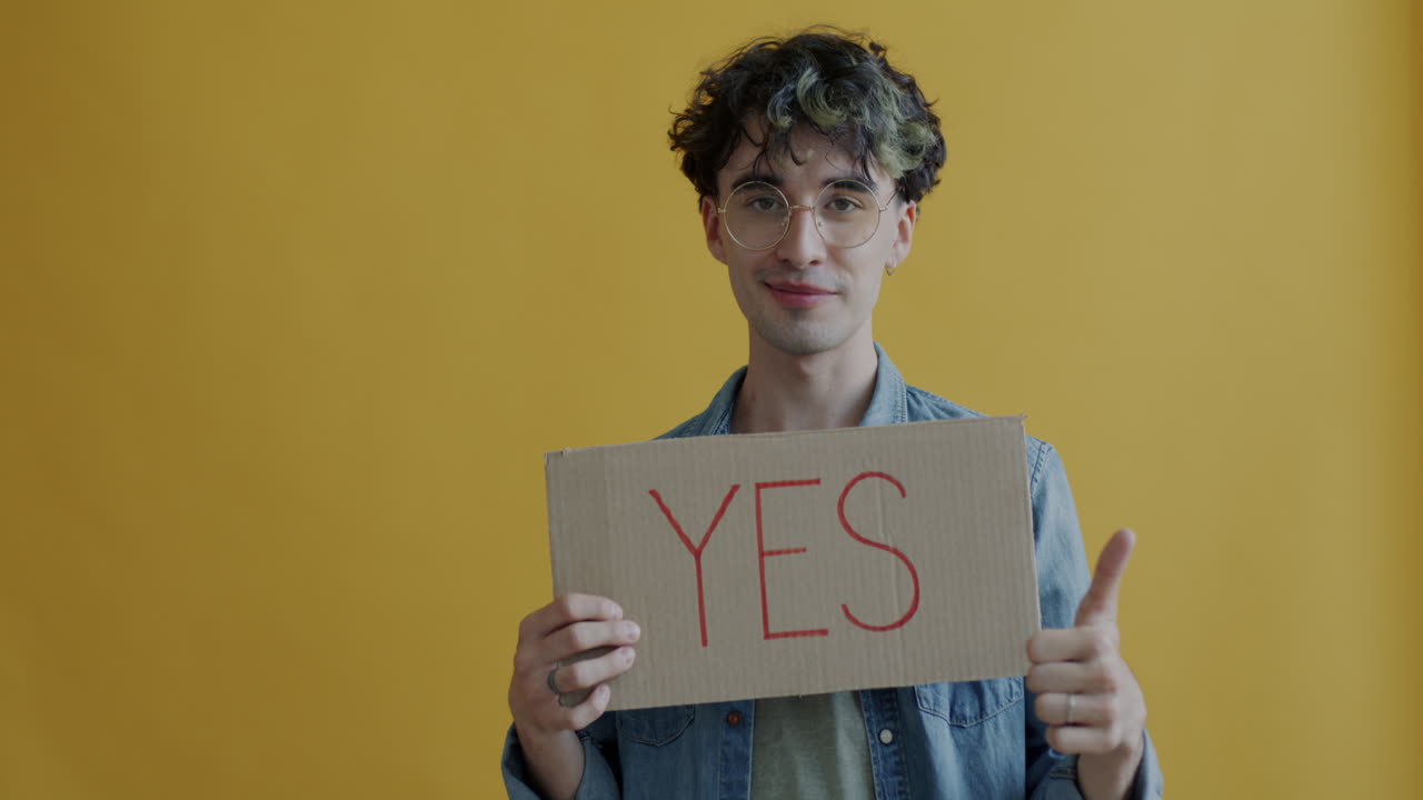 Person Holding a Sign Saying 'Yes'