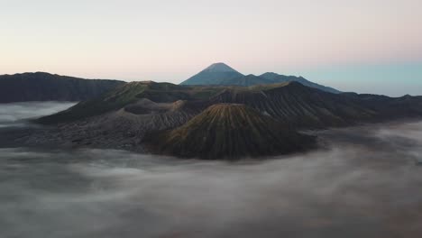 beautiful view of mount bromo national park in the morning with thin mist covering the area.