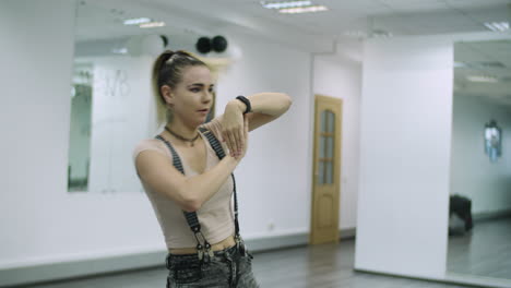 medium shot of caucasian dancer choreographer performing freestyle animation in a dance studio