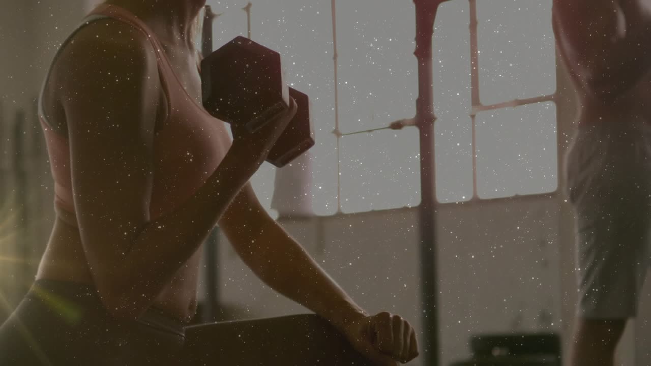 Woman bracing elbow on thigh initiating controlled hex dumbbell curls for fitness, lens flare grain