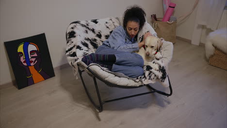 woman loves her dog, labrador puppy enjoys owner's company, girl snuggles with her fluffy furry friend, cuddling with cute purebred dog, pet sitting, animal daycare, therapy dog, human dog connection