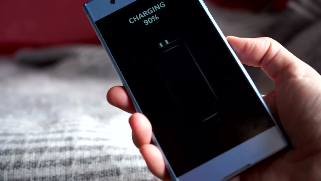 wireless smartphone charging concept, full green battery icon on a phone screen