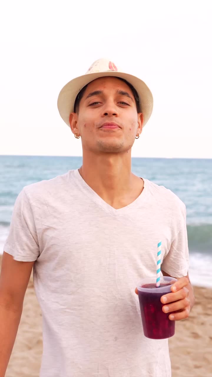 Man enjoying a drink on the beach