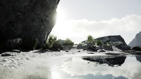 rugged rock cliff with mountains in the ocean