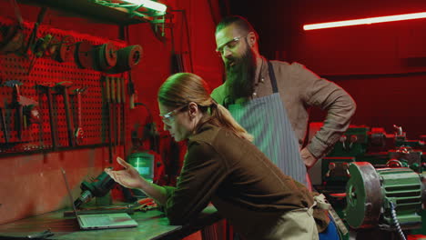 Caucasian-woman-and-man-welders-in-workshop