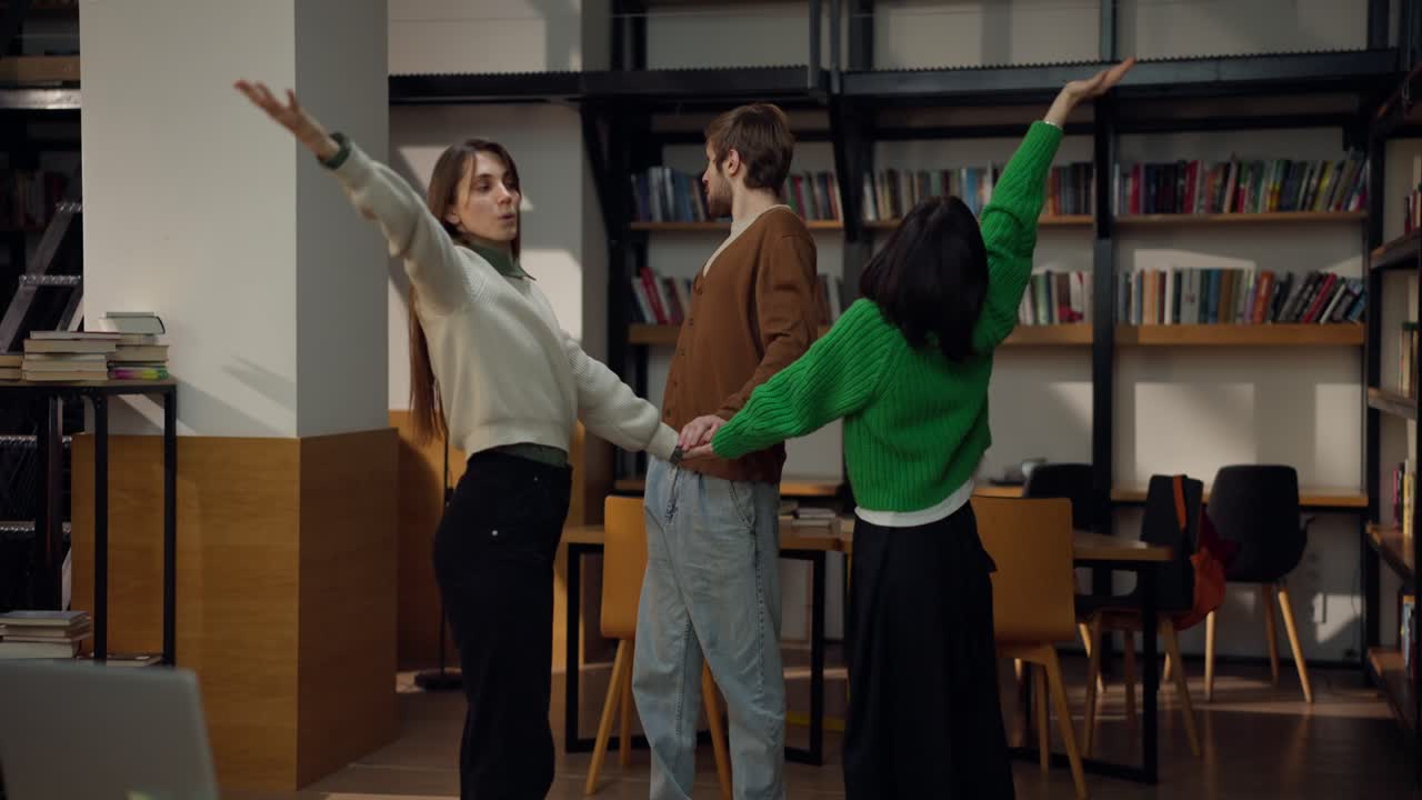 Students High-Fiving in a Library