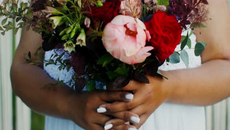 bride holding a beautiful bouquet of flowers