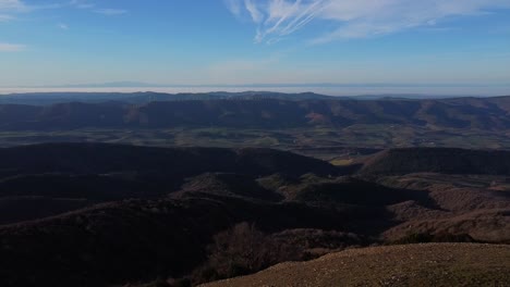 drone flight over a mountain top at golden hour