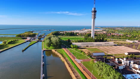 picturesque of the lelystad waterfront in the netherlands. telecom tower approached from drone.