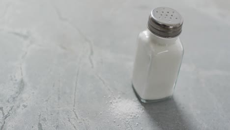 Video-of-salt-in-a-salt-shaker-on-stone-kitchen-worktop