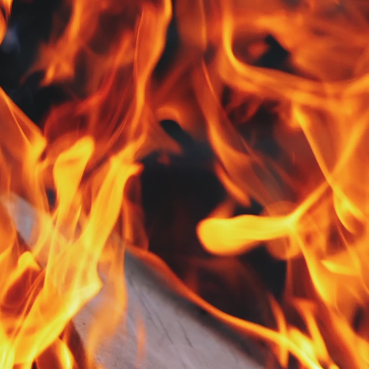 Burning fire in a home fireplace. Slow motion