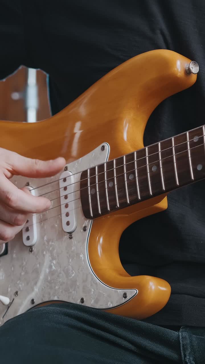 Beautiful melodies emerge from a skilled hand playing a string instrument