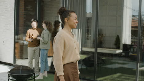 a young afroamerican woman gives a welcome home hug to her friend